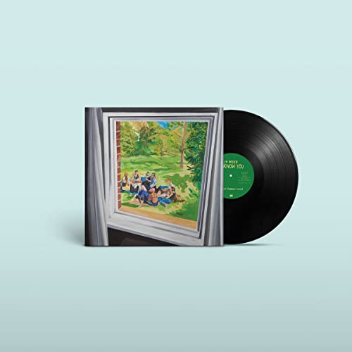 Vinyl record and album cover depicting people framed in a window.