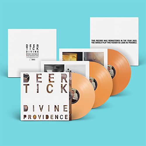 Deer Tick Divine Providence album featuring three orange vinyl records and white record sleeves.