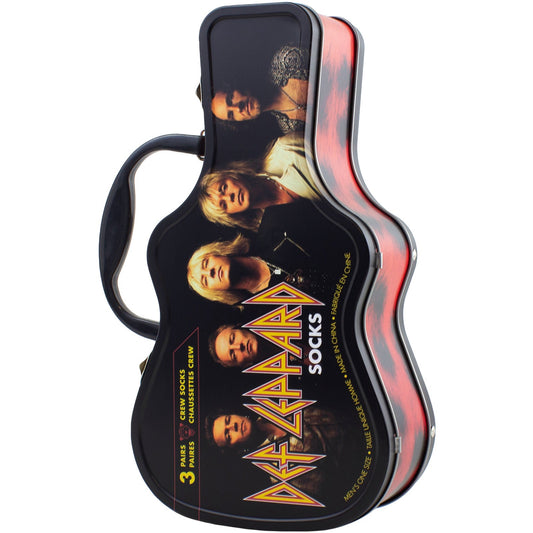 Three Def Leppard branded socks displayed next to a guitar-shaped storage tin.