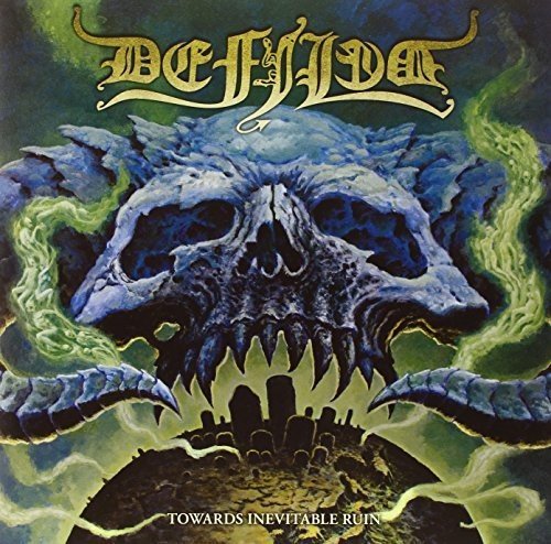 Album cover: skull with glowing green eyes over a graveyard scene.