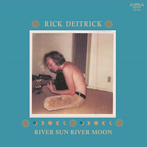 Vinyl record cover: portrait of a man with a guitar, sun and moon motifs.