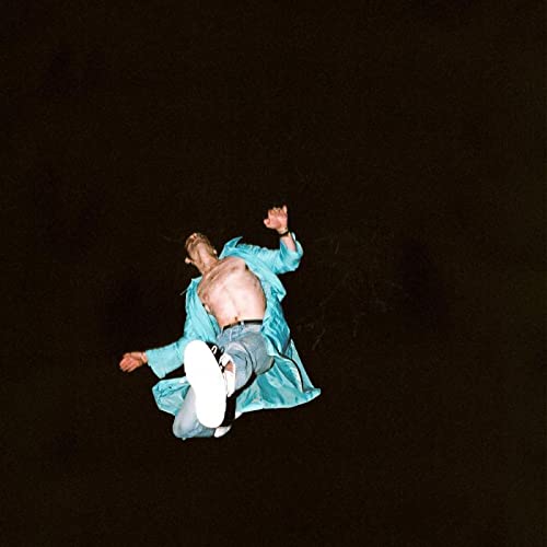 Man in blue coat falling against a black background.