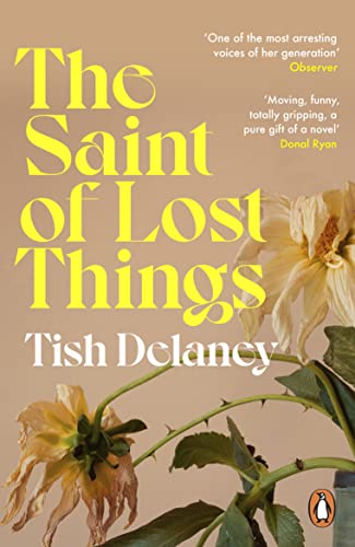 Book cover with yellow title text and wilted dahlias in foreground.