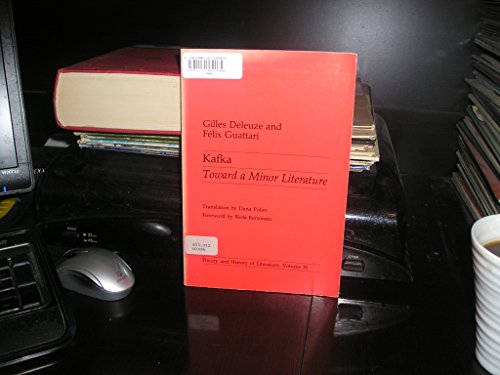 A red book titled Kafka Toward a Minor Literature stands on a desk.