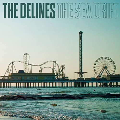 CD cover for The Delines’ “The Sea Drift” with a seaside pier scene.