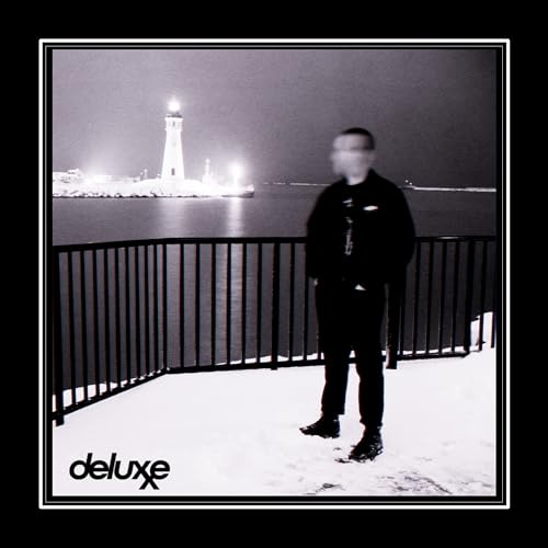 Black and white album cover with blurred figure and lighthouse.