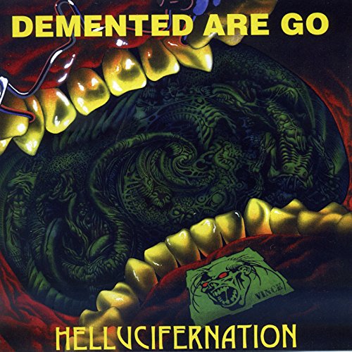 Album cover showing a wide-open mouth with yellow teeth and a dark, swirling interior.