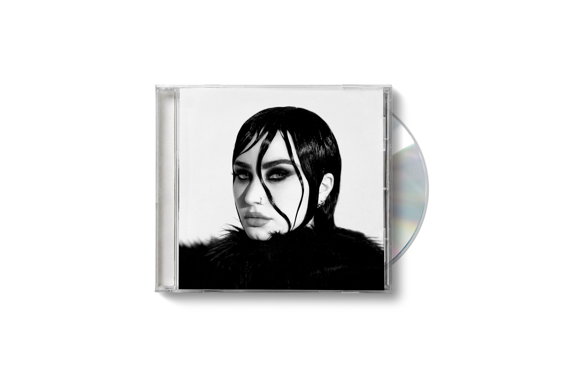 "Demi Lovato CD case with black and white cover art and partially visible disc."