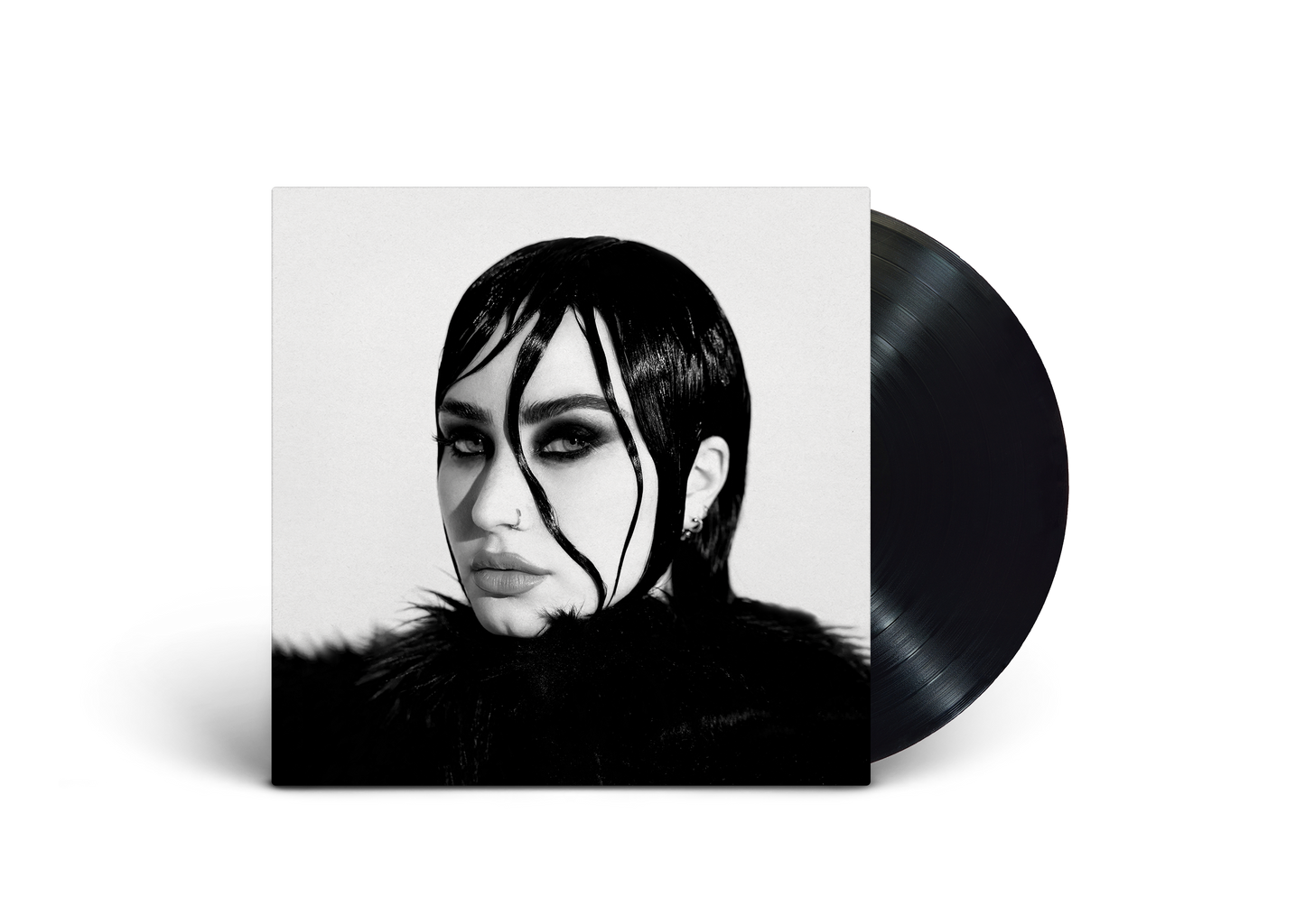 Vinyl record sleeve with black and white portrait of Demi Lovato, partially covering the record.