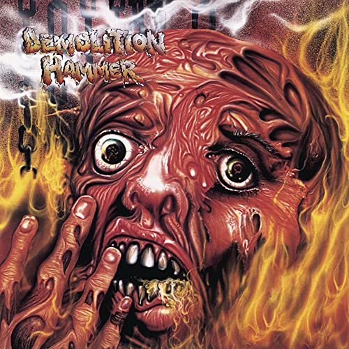 Album cover: distorted, screaming face engulfed in flames, metal band logo.