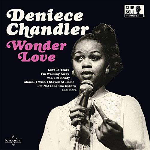 The vinyl album cover features a woman singing into a microphone, black background.