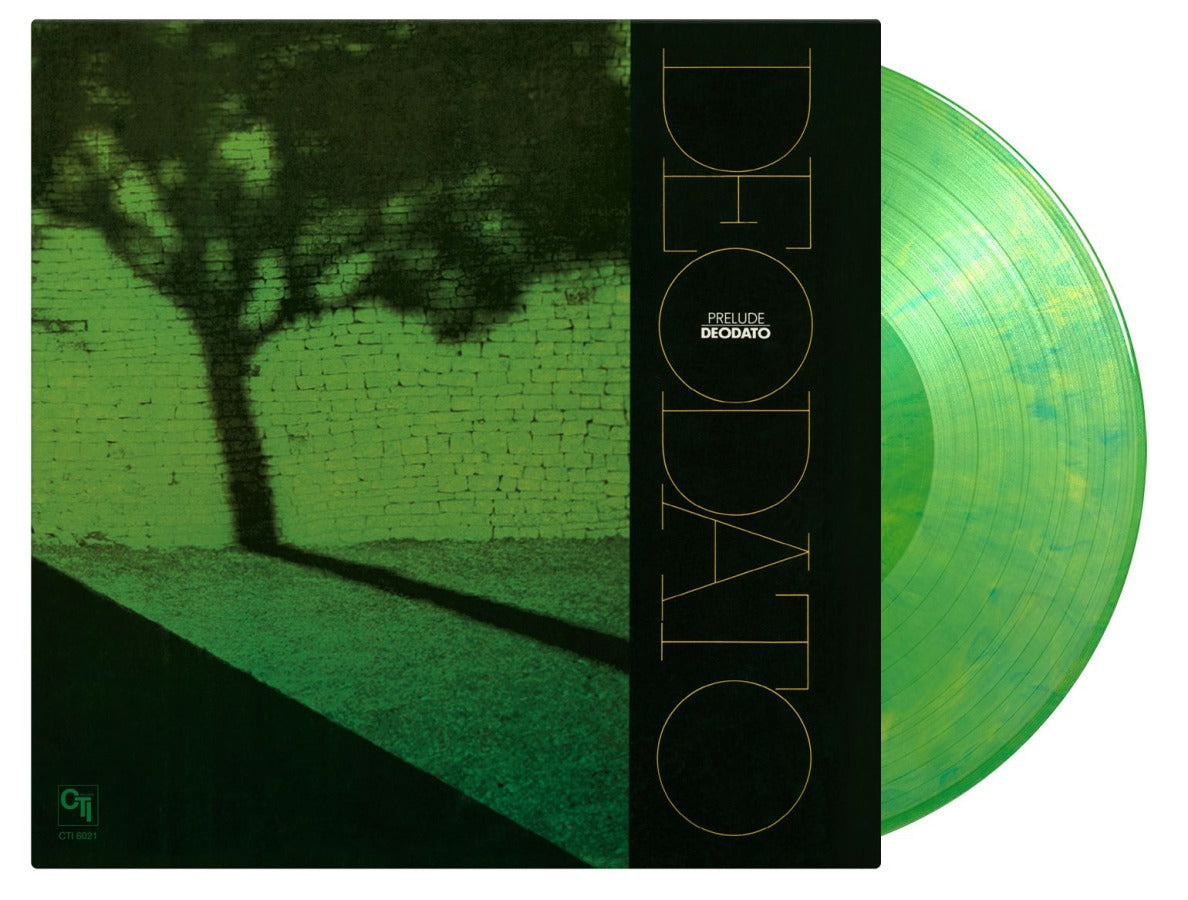 Green vinyl record with album cover featuring a tree and text.