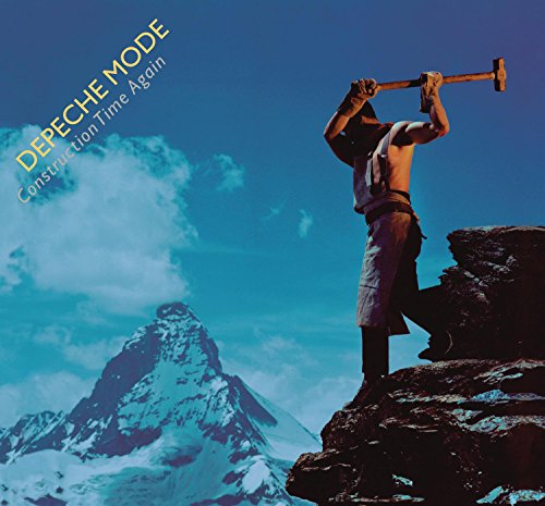 Depeche Mode album cover: man with hammer on rocky peak.