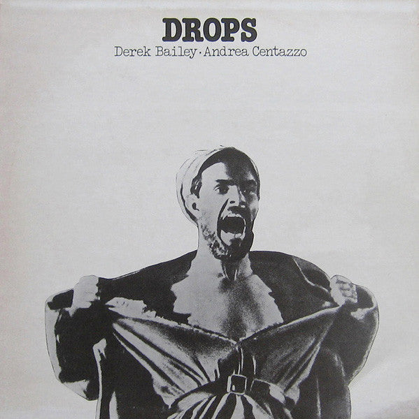 Black and white album cover featuring a man dramatically opening his jacket.