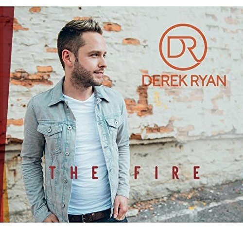 Man standing against a brick wall with "Derek Ryan - The Fire" text overlay.