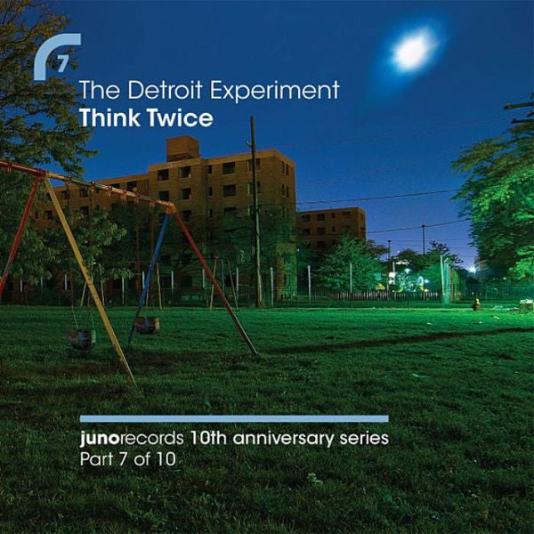 CD cover: nighttime urban scene with a playground and apartment building.
