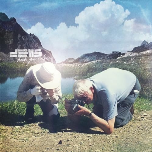 Vinyl album cover: two photographers kneeling in a mountainous landscape.
