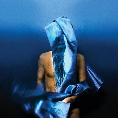 Torso and shoulders of a person with a blue cloth covering their face.
