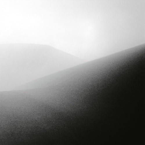 Black and white abstract vinyl record cover with foggy mountain shapes.