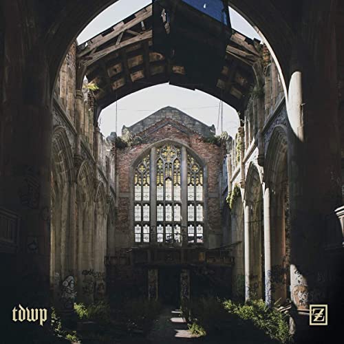 CD cover art: crumbling, gothic-style building interior with arched windows.