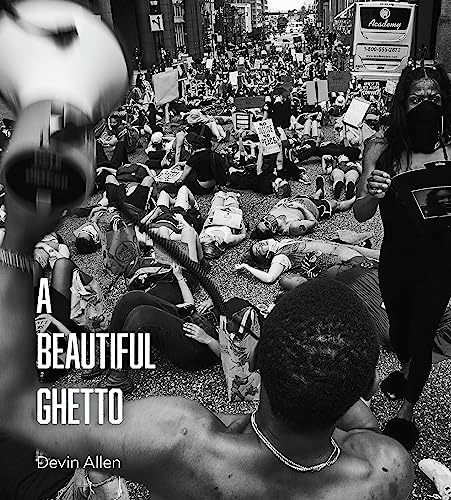 Black and white photo of a protest with people lying on the ground.