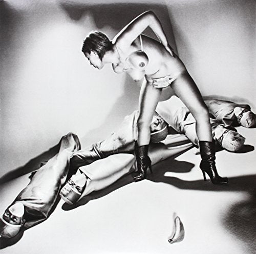 Black and white photo of two figures in provocative poses.