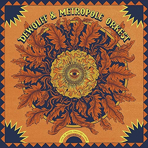 CD cover: ornate floral design with a central eye motif.