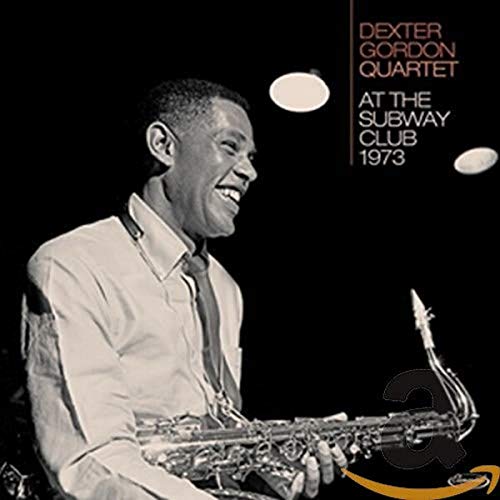 Dexter Gordon playing saxophone on album cover, black and white photo.