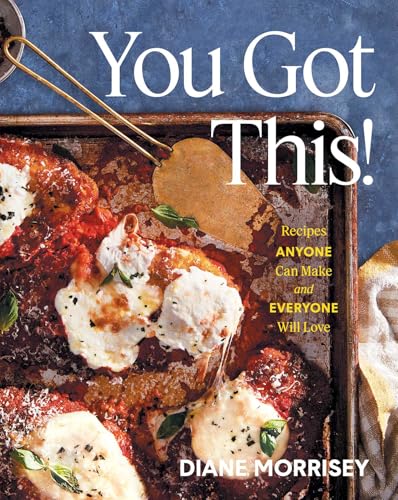 Cookbook cover featuring chicken parmesan on a baking sheet with a metal spatula.
