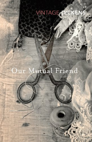 Book cover for Our Mutual Friend featuring vintage sewing scissors, thread, and lace fabric.