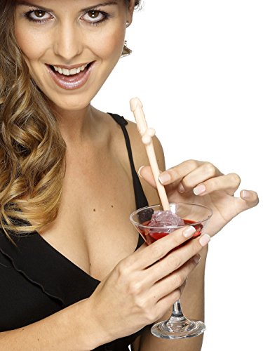 Woman holding a pink, novelty shaped straw over a cocktail glass.
