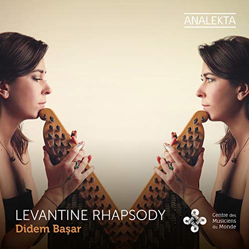 "CD cover featuring a mirrored image of a woman playing a kanun."