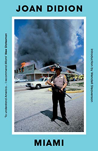 Book cover: "Miami" by Joan Didion, showing a burning building and police officer.