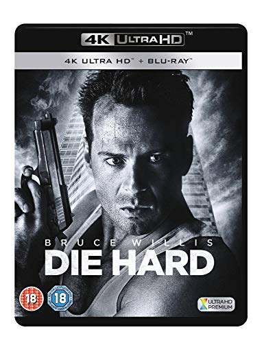 Die Hard Blu-ray cover featuring Bruce Willis holding a gun, dark background.