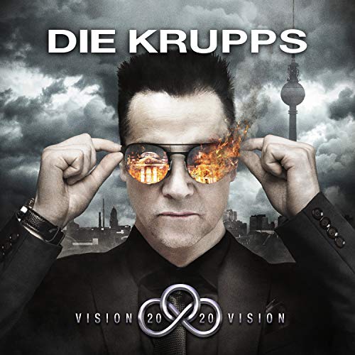 Die Krupps album cover featuring a man with fiery reflections in sunglasses.