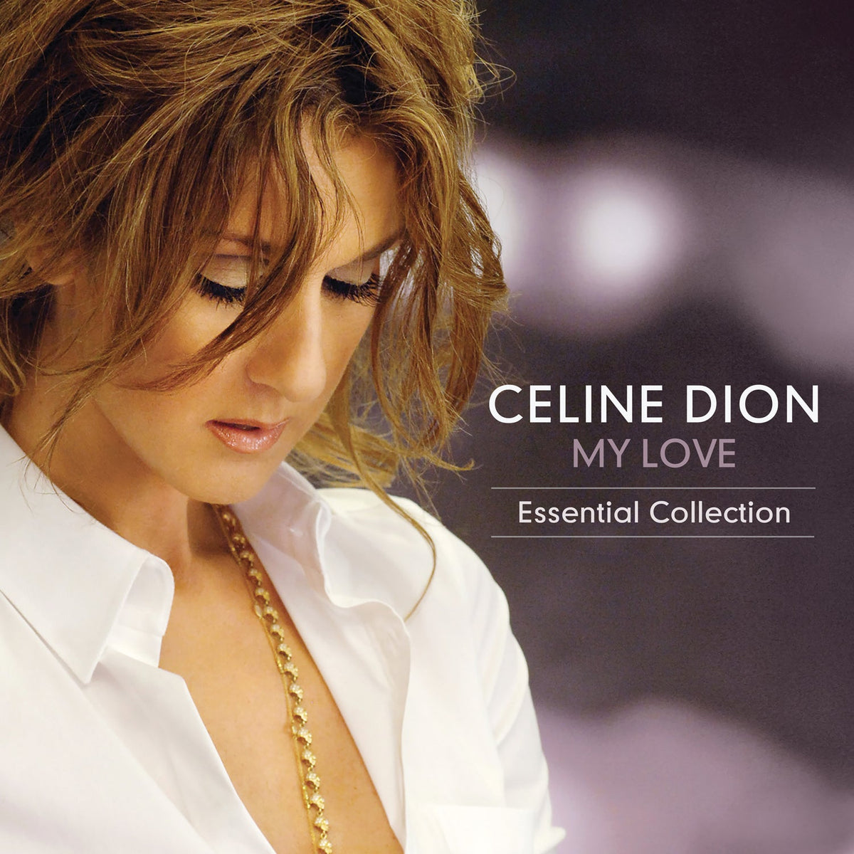 Celine Dion looking down, wearing a white shirt and gold necklace on album cover.