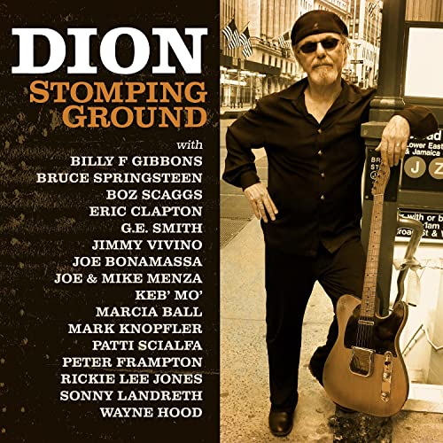 Dion album cover featuring the musician with a guitar in New York City.