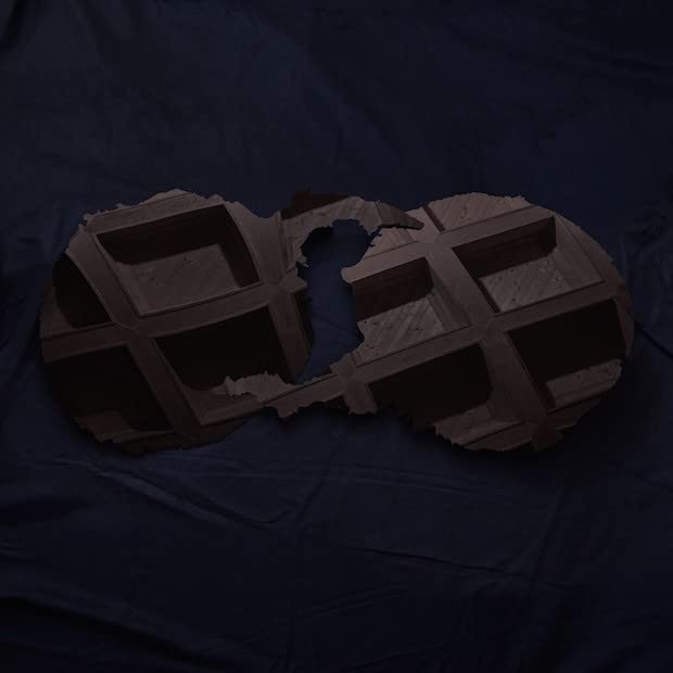 Dark album cover featuring a textured, geometric shape resembling a footprint.
