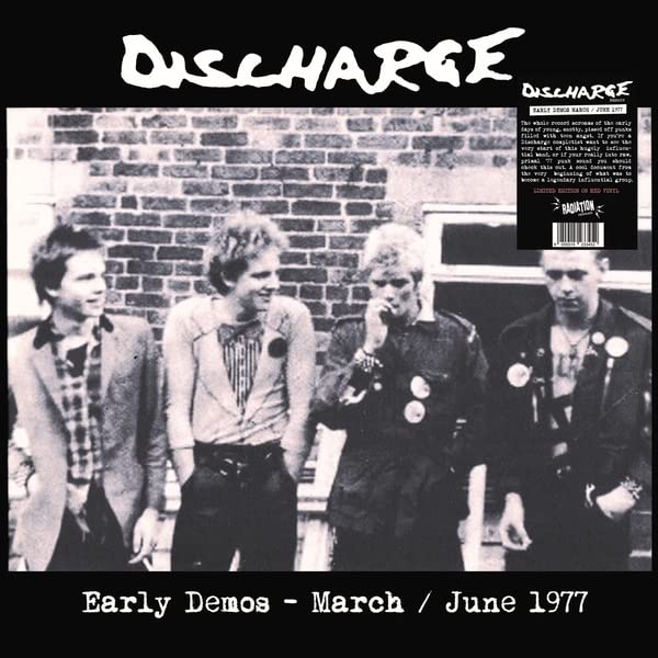 Black and white photo of a punk band, album cover for “Early Demos.”