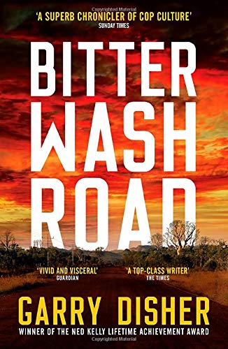 Book cover: “Bitter Wash Road” with a fiery red sky and a lonely road.