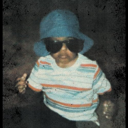 Man in a blue bucket hat and sunglasses, grainy texture.