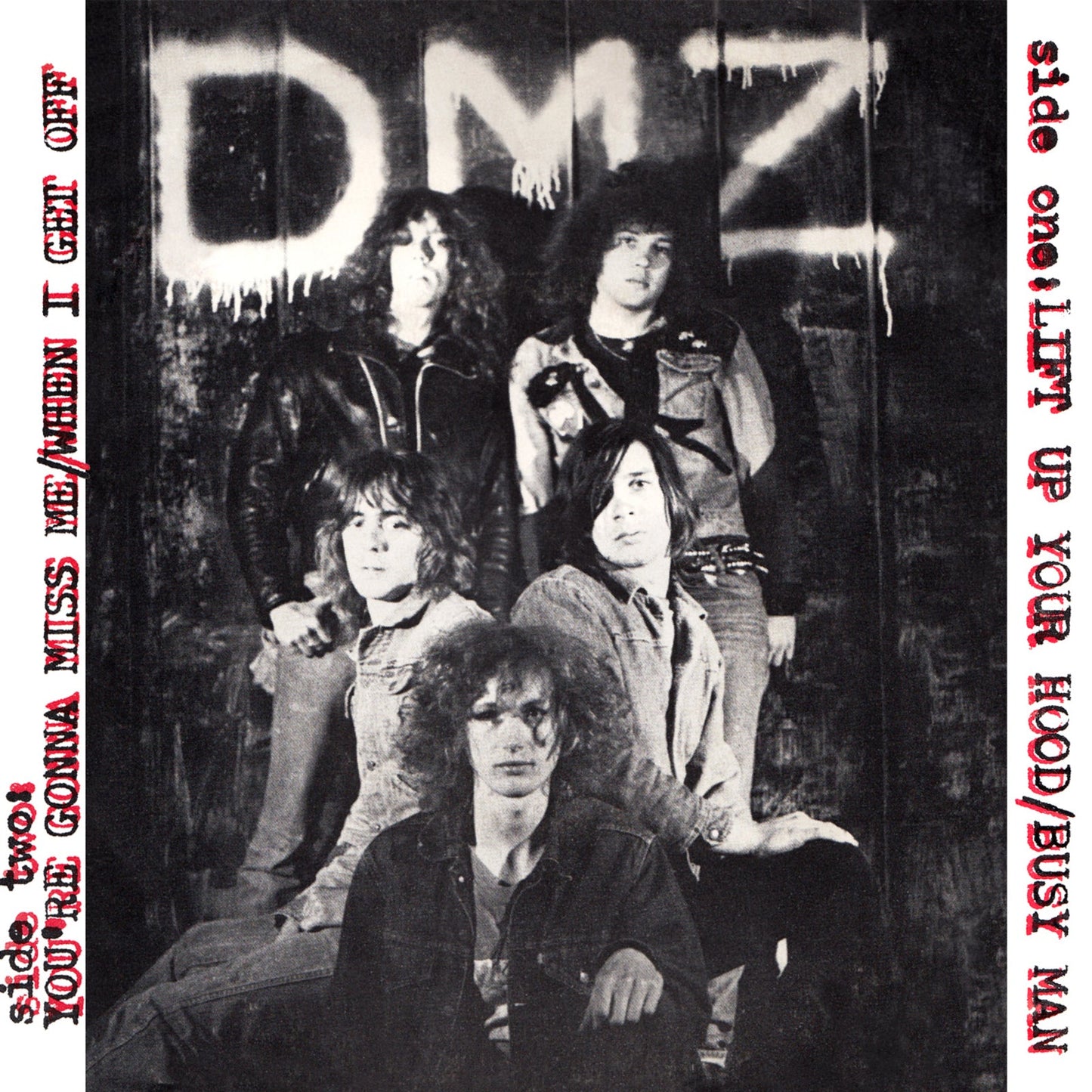 Black and white vinyl record cover featuring a band portrait.