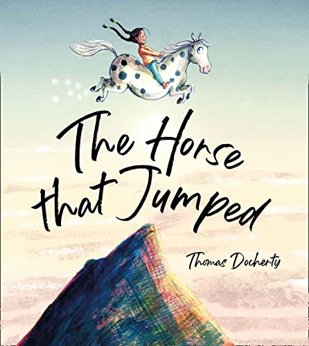 Girl riding a spotted horse jumping over a colorful hill.