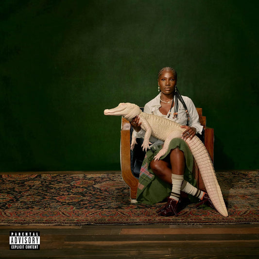 Doechii sits with an alligator, album cover for “Alligator Bites.”