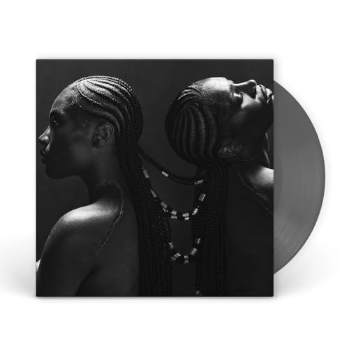 Black and white vinyl record with portrait of Doechii in braids.