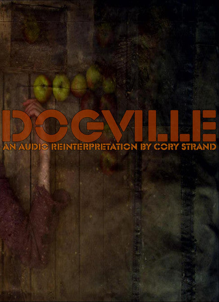 DVDCLPB DVD cover for Dogville featuring a hand and apples on wood.