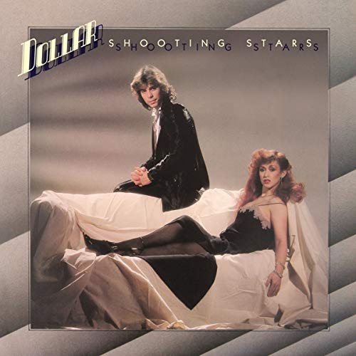 Vinyl record cover featuring a man and woman on a bed, with "Dollar" and "Shooting Stars" text.