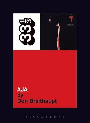 Book cover for Steely Dan’s “Aja” with red and black design.
