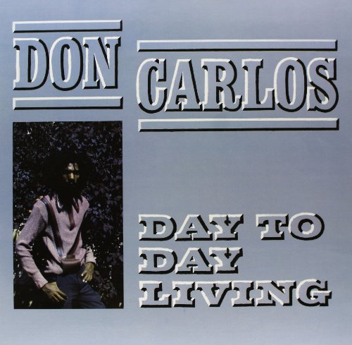 Album cover with man in pink shirt, grey background, and bold text "Don Carlos Day to Day Living".