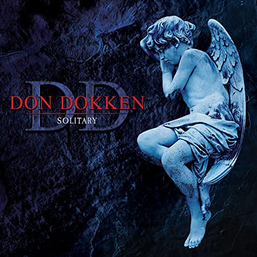 A stone angel statue sits against a dark, textured blue background with album text.